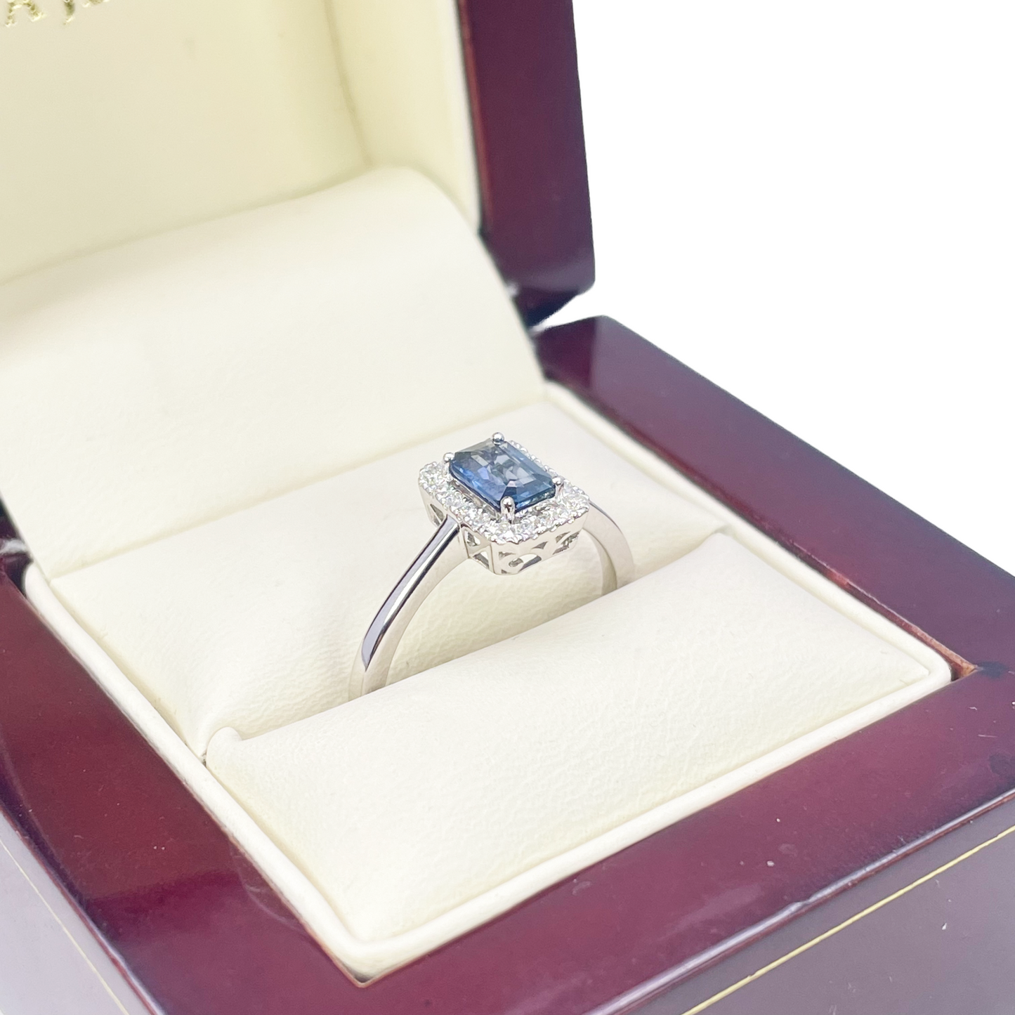18ct White Gold Emerald Cut Blue Sapphire & Diamond Halo Ring 0.79ct