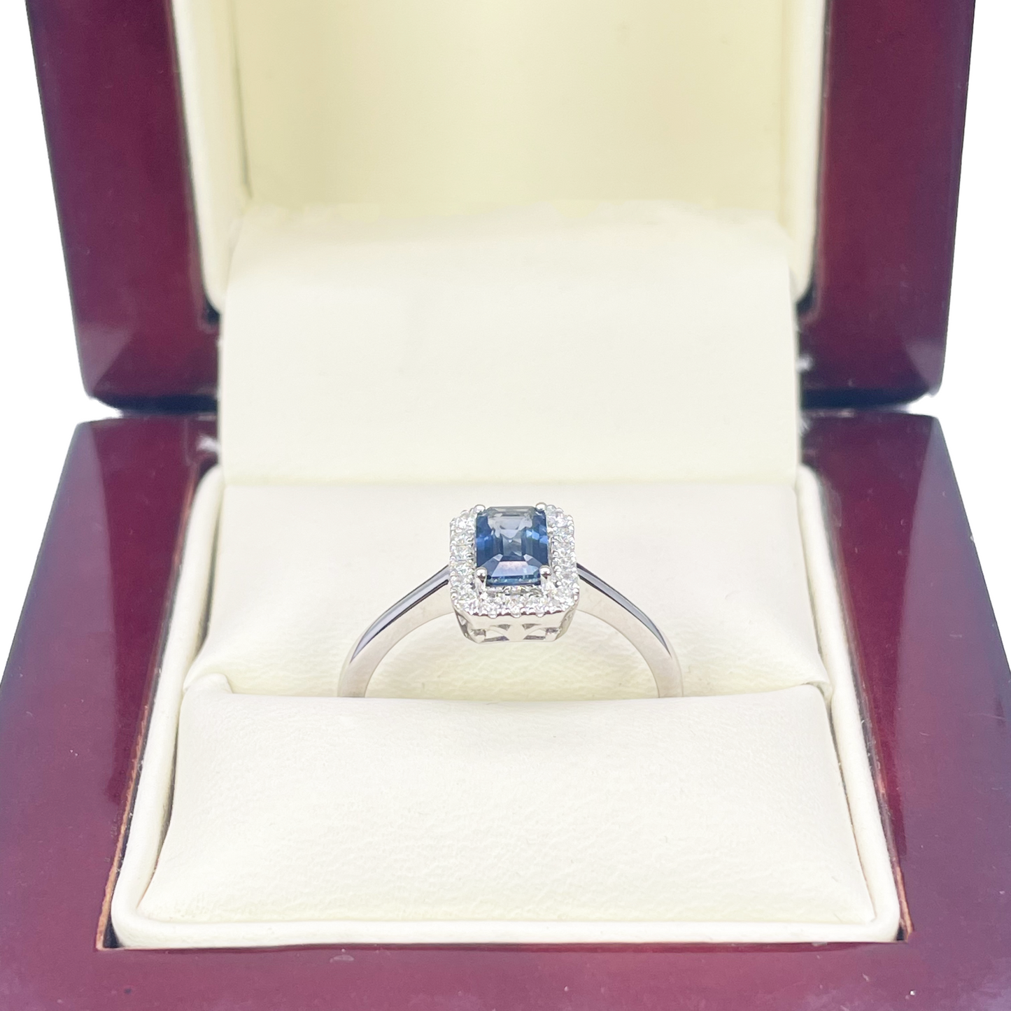 18ct White Gold Emerald Cut Blue Sapphire & Diamond Halo Ring 0.79ct